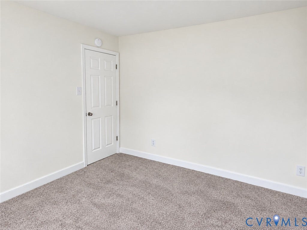 4609 Coldstream Drive, Richmond, VA 23234 Neutral wall color, paneled door, and carpeted flooring
