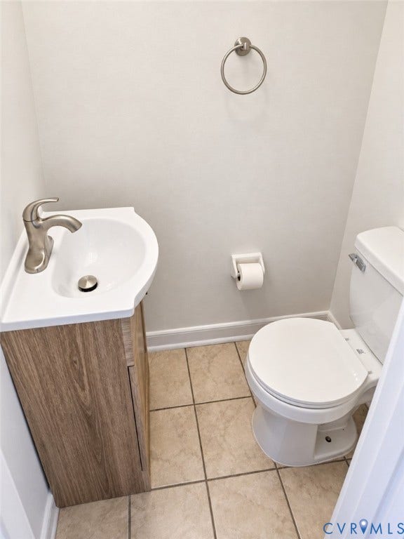 4609 Coldstream Drive, Richmond, VA 23234 Compact vanity with wood-finish cabinetry and integrated sink