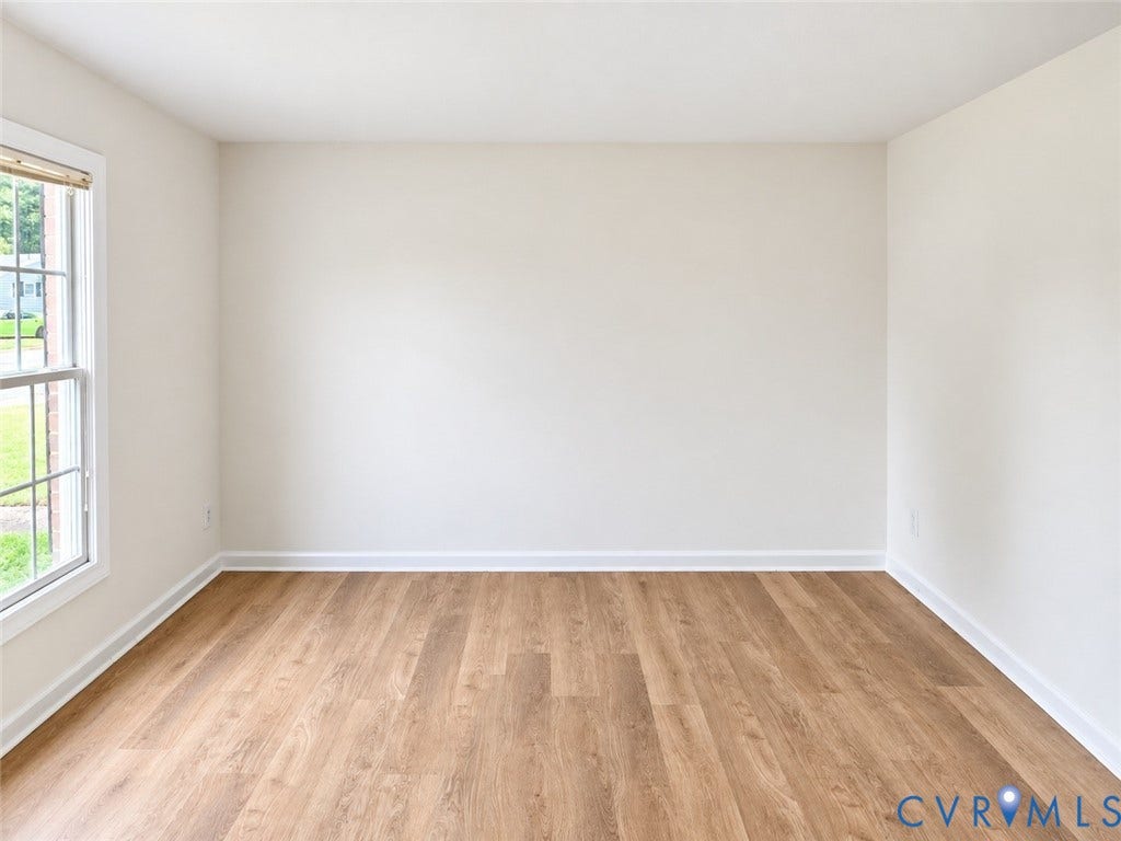 4609 Coldstream Drive, Richmond, VA 23234 Light-toned walls, wood-finish flooring, and a multi-pane window