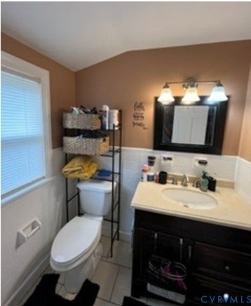 3732 Birdwood Road, Brookbury, Richmond, VA 23234 Bathroom featuring a dark wood vanity with a light-colored countertop, an integrated sink, and a three-light fixture