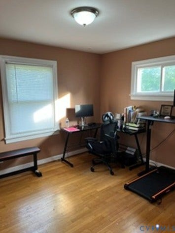 3732 Birdwood Road, Brookbury, Richmond, VA 23234 Room featuring wood-finish flooring, two windows with white trim, and a ceiling-mounted light fixture