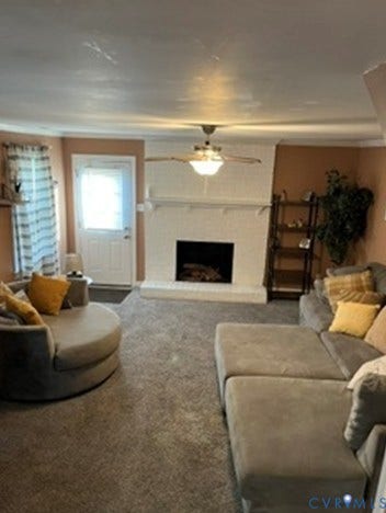 3732 Birdwood Road, Brookbury, Richmond, VA 23234 Living area featuring a white brick fireplace with hearth, a ceiling fan with integrated lighting, and wall-to-wall carpeting