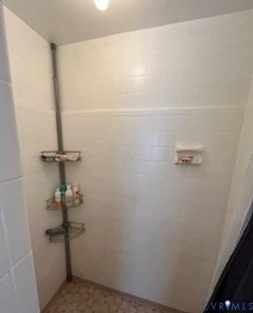 3732 Birdwood Road, Brookbury, Richmond, VA 23234 Shower enclosure with white subway tile walls and patterned floor tile