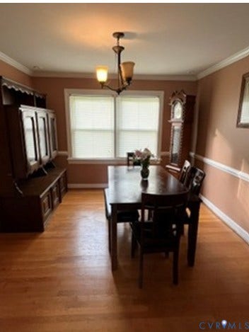3732 Birdwood Road, Brookbury, Richmond, VA 23234 Hardwood flooring throughout featuring a two-light chandelier, double windows with blinds, and white crown molding