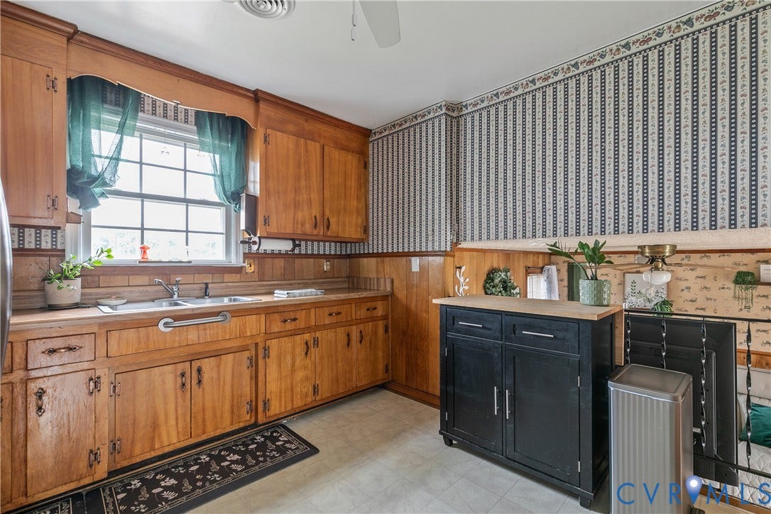 Kitchen with wood cabinets - open to family room below