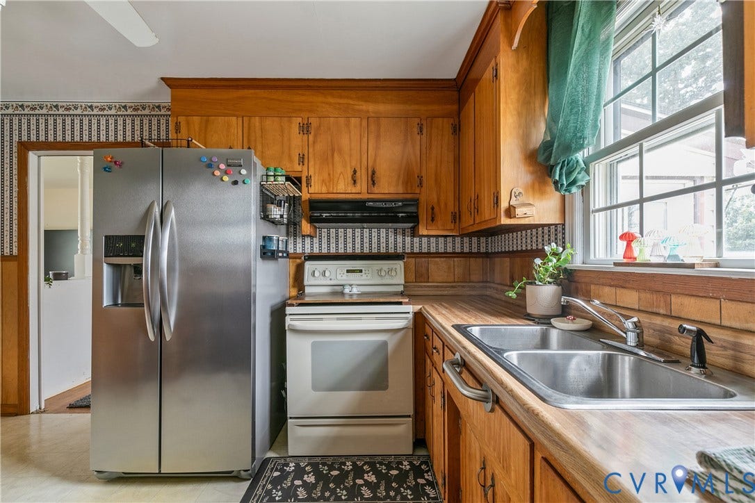 Sunny kitchen with SS refrigerator