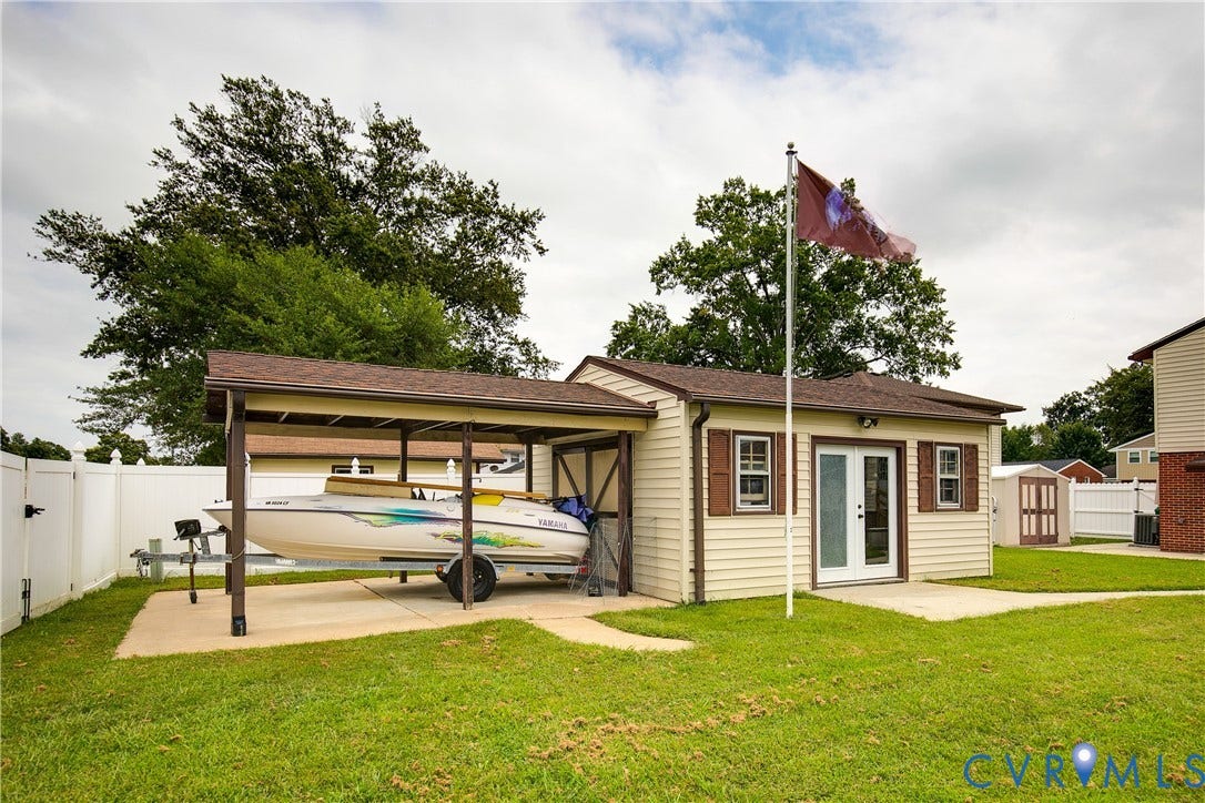 Detached garage space with a covered pad