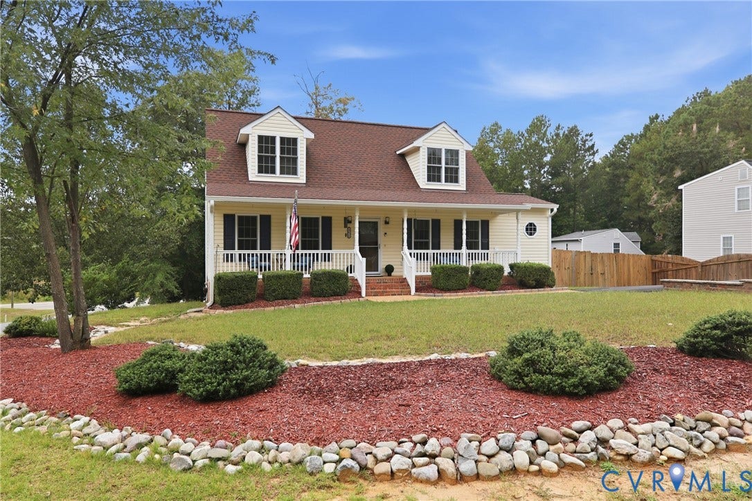 10624 Hamlin Drive, Hamlin Estates, Chester, VA 23831 Traditional-style home featuring a covered front porch, dormer windows, and a circular window accent