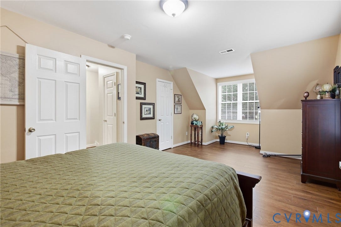 10624 Hamlin Drive, Hamlin Estates, Chester, VA 23831 Wood-finish flooring, recessed lighting, white paneled doors, and a double window with blinds