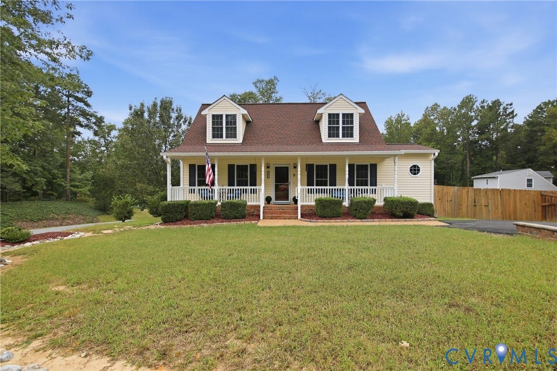 10624 Hamlin Drive, Hamlin Estates, Chester, VA 23831 Dormered Cape Cod with a covered porch, established foundation plantings, and a side-entry driveway