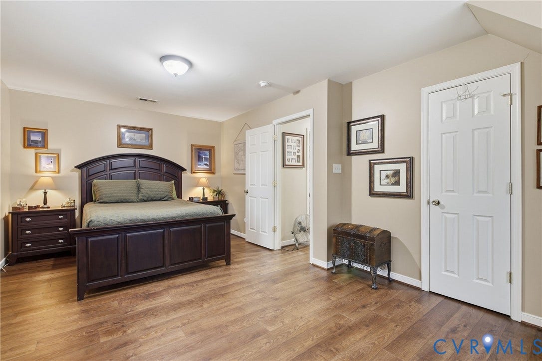 10624 Hamlin Drive, Hamlin Estates, Chester, VA 23831 Wood-finish flooring throughout, complemented by light neutral wall paint