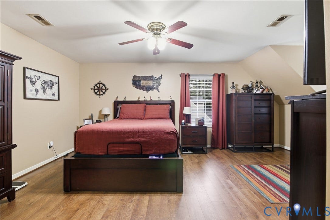 10624 Hamlin Drive, Hamlin Estates, Chester, VA 23831 Wood-finish flooring with a ceiling fan light fixture and a window with blinds
