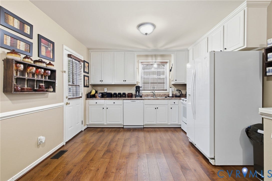 10624 Hamlin Drive, Hamlin Estates, Chester, VA 23831 Kitchen featuring white cabinetry, wood-finish flooring, a window with blinds, and a built-in dishwasher