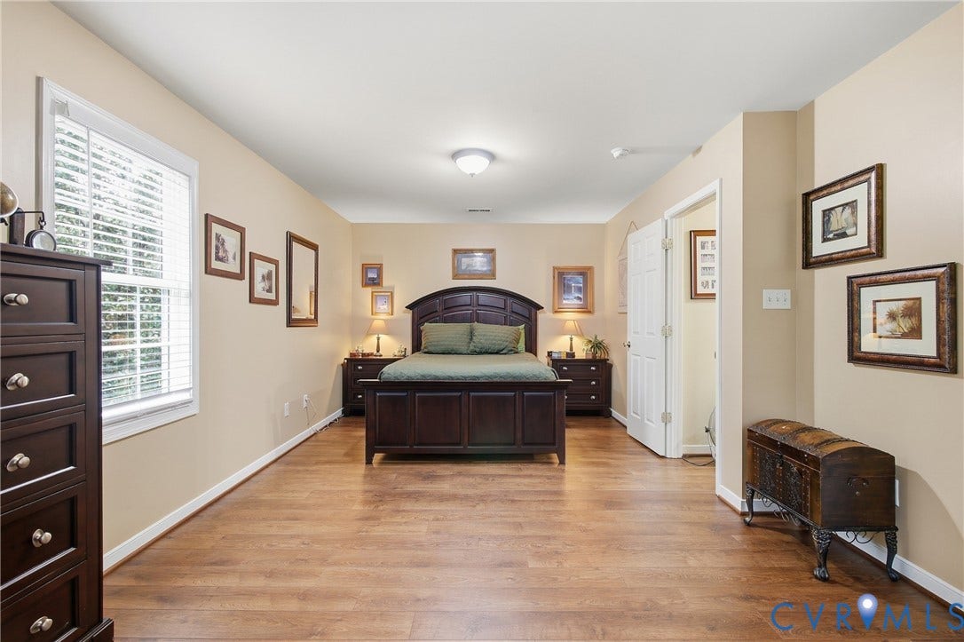 10624 Hamlin Drive, Hamlin Estates, Chester, VA 23831 Warm neutral wall tones with wood-finish flooring