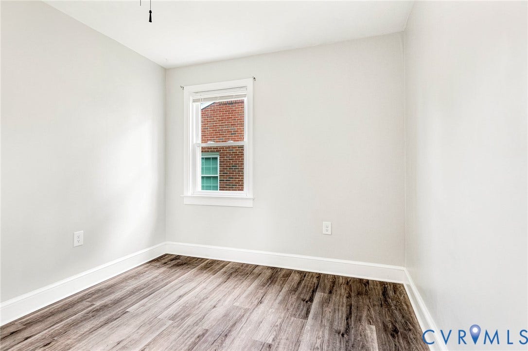 507 Walnut Avenue, Walnut Court, Colonial Heights, VA 23834 Wood-finish flooring, white walls, and a single window with blinds