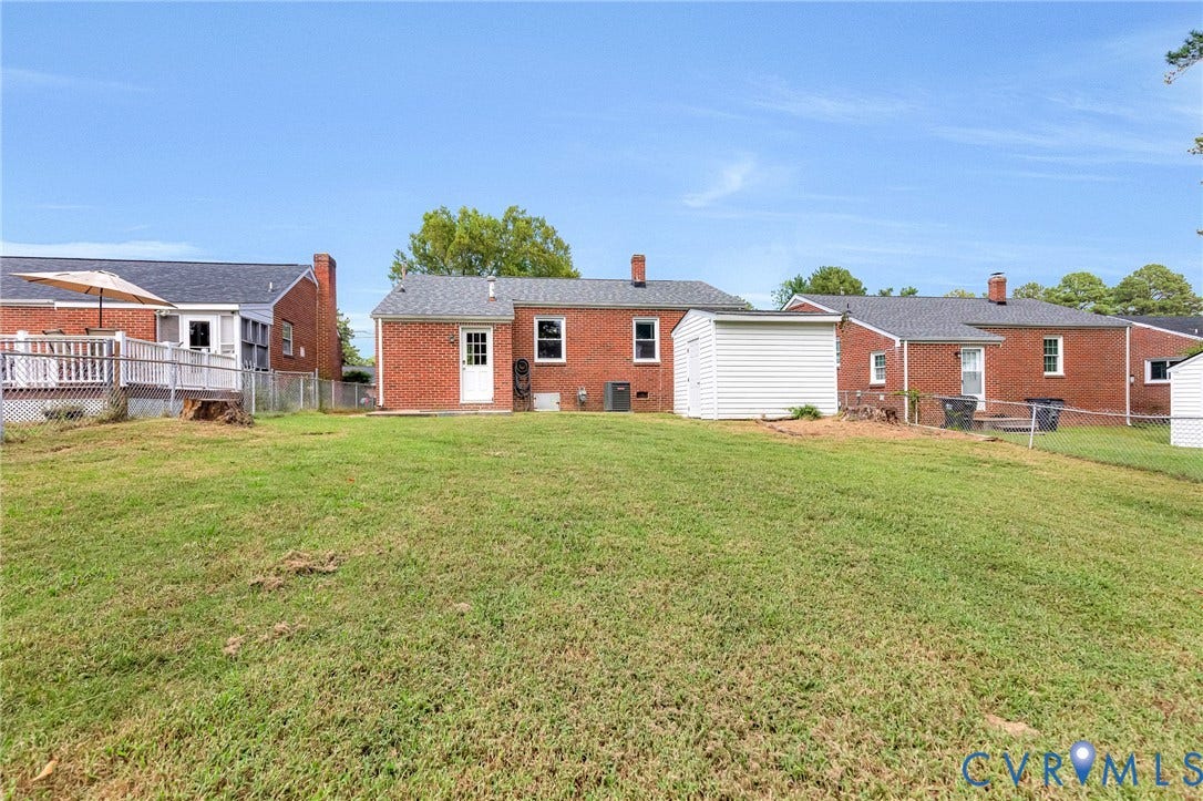 507 Walnut Avenue, Walnut Court, Colonial Heights, VA 23834 Expansive grassy yard with a white storage shed and a raised deck with white railings