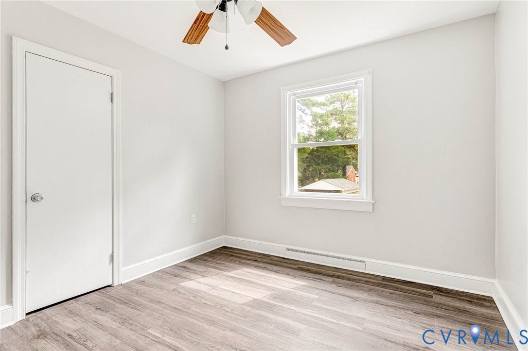 507 Walnut Avenue, Walnut Court, Colonial Heights, VA 23834 Wood-finish flooring, white trim, single window, and a ceiling fan with light fixture