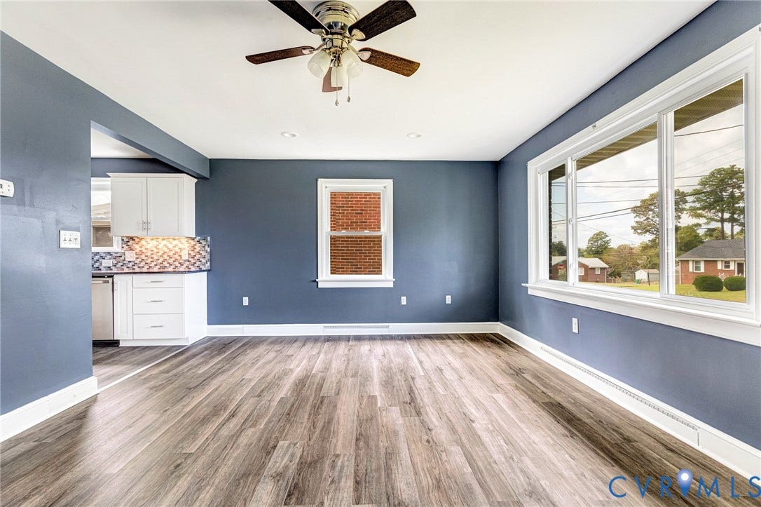 507 Walnut Avenue, Walnut Court, Colonial Heights, VA 23834 Wood-finish flooring with white trim, a ceiling fan with light fixture, and multiple windows providing ample natural light