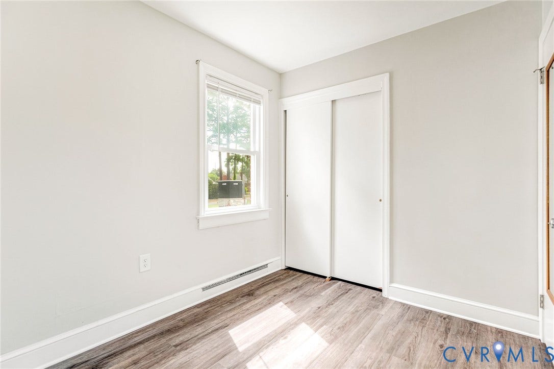 507 Walnut Avenue, Walnut Court, Colonial Heights, VA 23834 Light gray wall paint, wood-finish flooring, white window trim, white sliding closet doors, white baseboards