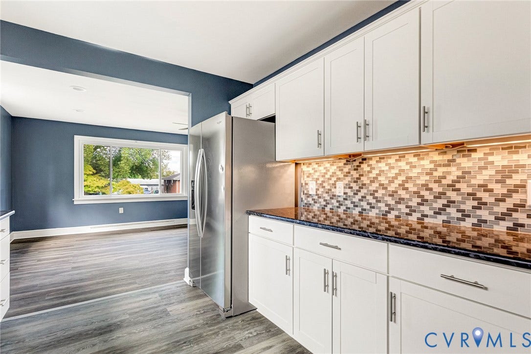 507 Walnut Avenue, Walnut Court, Colonial Heights, VA 23834 Kitchen featuring white cabinetry, dark countertops, mosaic tile backsplash, stainless steel refrigerator, and wood-finish flooring