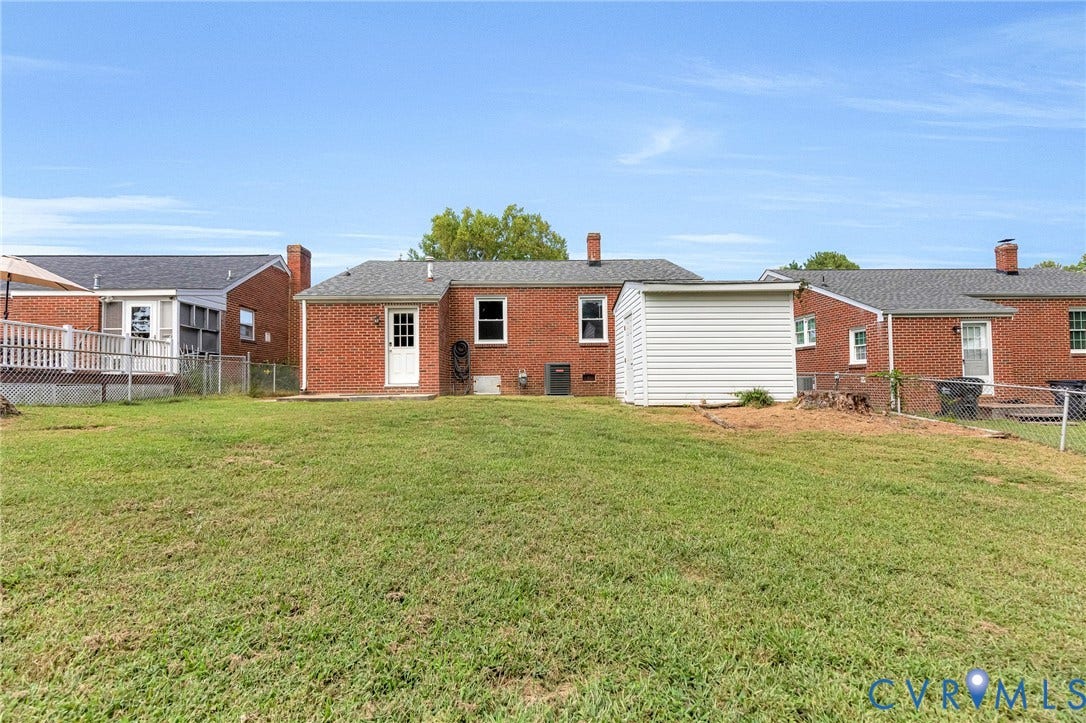 507 Walnut Avenue, Walnut Court, Colonial Heights, VA 23834 Expansive grassy yard with a white storage shed and brick exterior