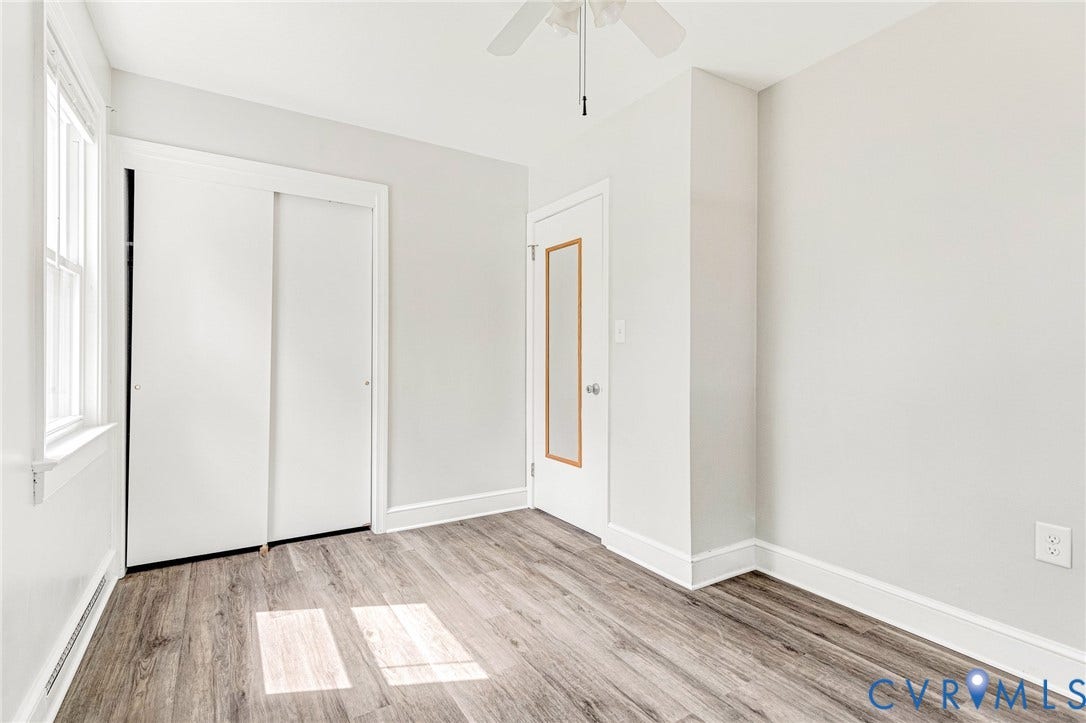 507 Walnut Avenue, Walnut Court, Colonial Heights, VA 23834 Wood-finish flooring, white walls, white trim, sliding closet doors, and a ceiling fan
