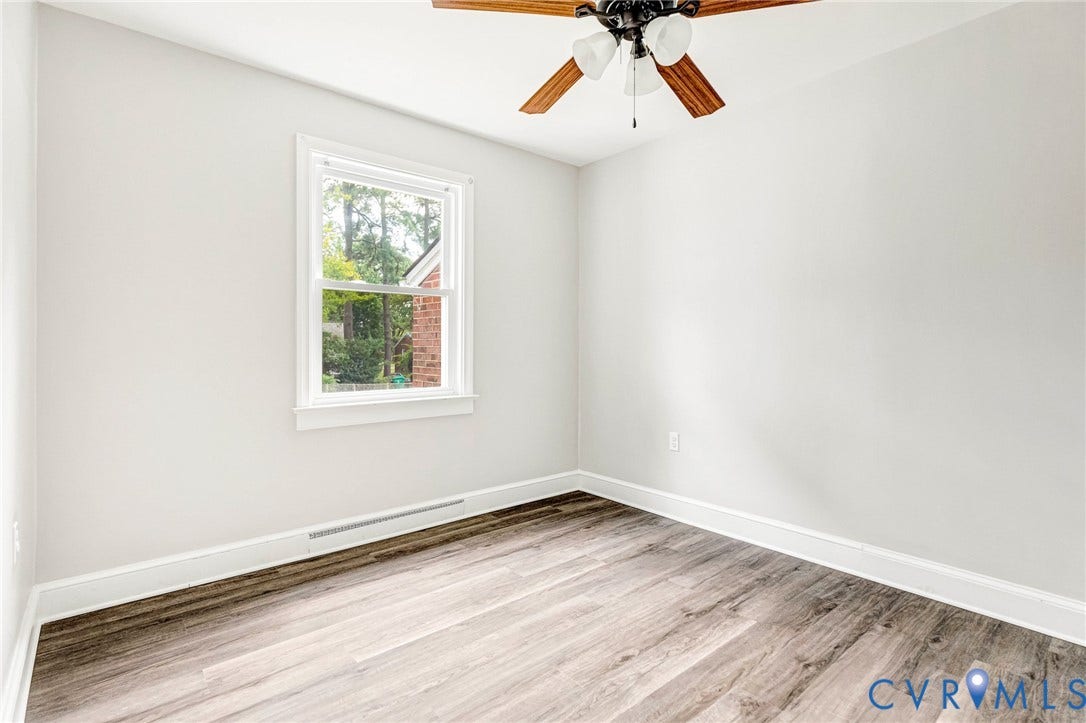 507 Walnut Avenue, Walnut Court, Colonial Heights, VA 23834 Wood-finish flooring, white walls, and a ceiling fan with light fixture