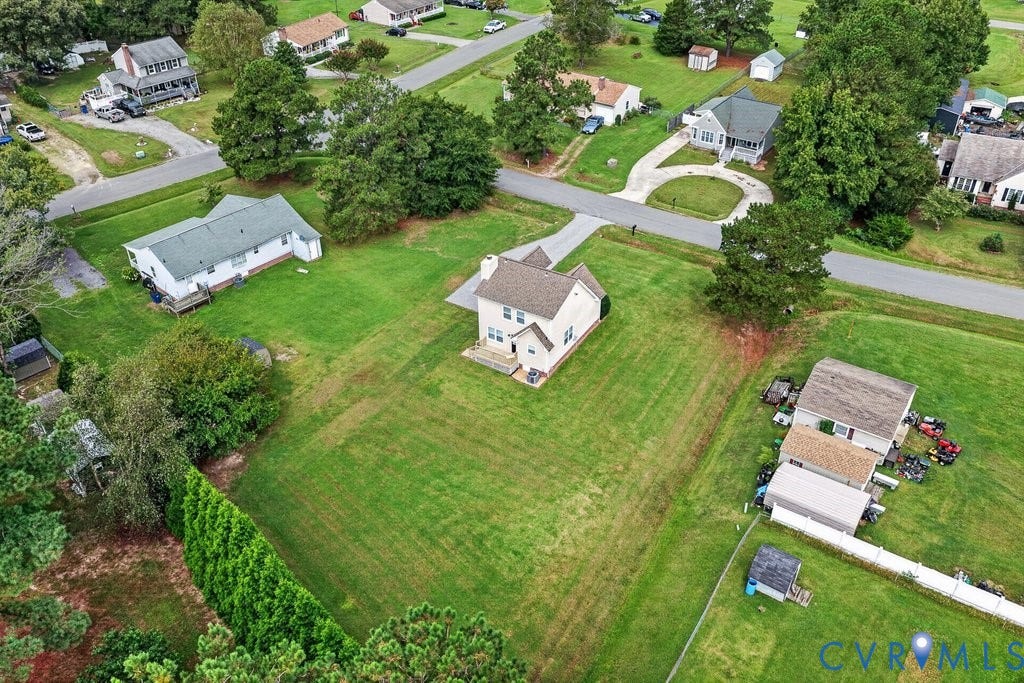 24607 Woodstream Lane, North Dinwiddie, VA 23803 Two-story residence with a light-toned exterior and a gabled roof