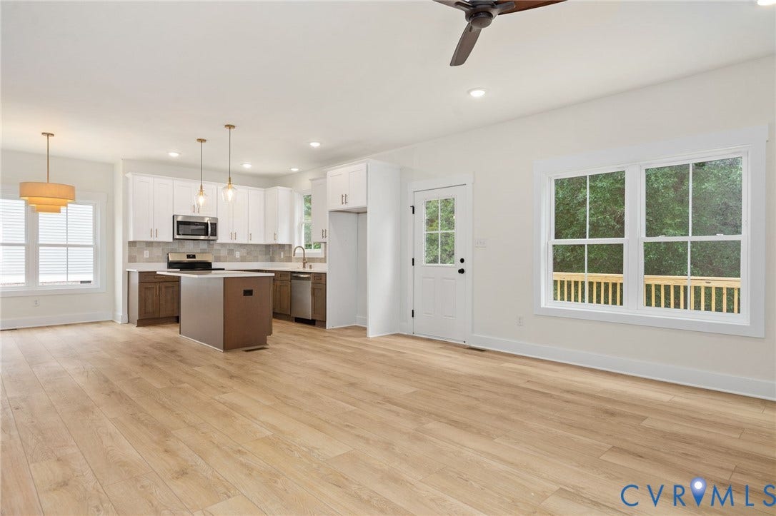 7603 Oster Drive, Chamberlayne Farms Area, Henrico, VA 23227 Open concept living space with light wood-finish flooring, white walls, and a modern ceiling fan