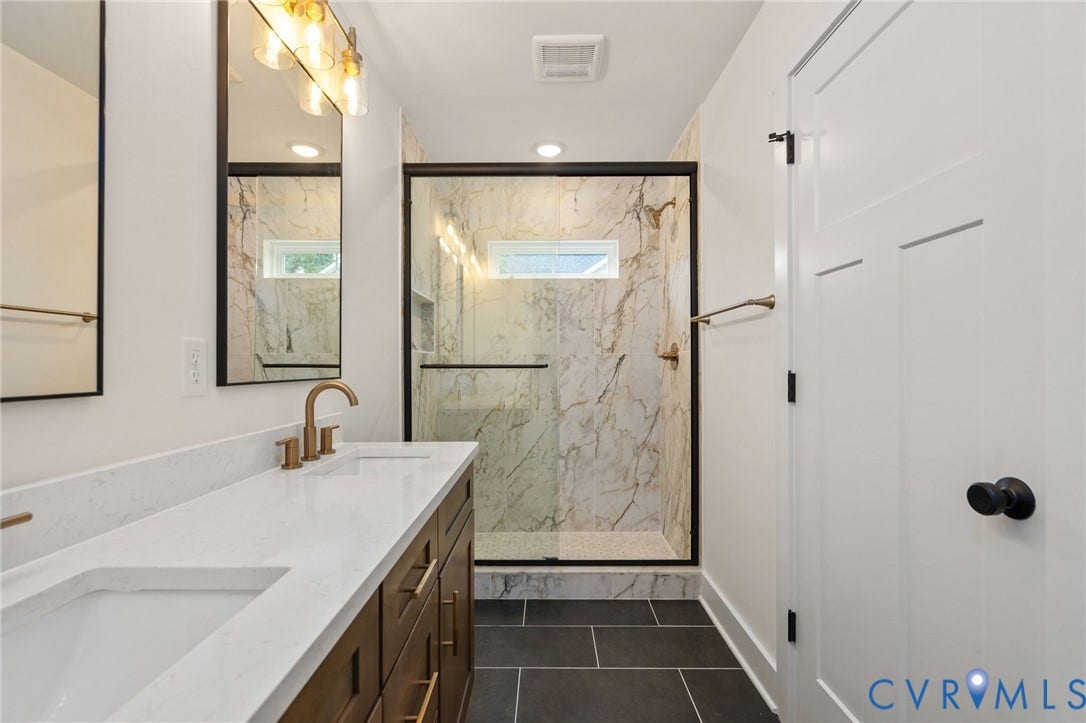 7603 Oster Drive, Chamberlayne Farms Area, Henrico, VA 23227 Dual vanity with white countertops, wood-finish cabinetry, and gold-tone fixtures