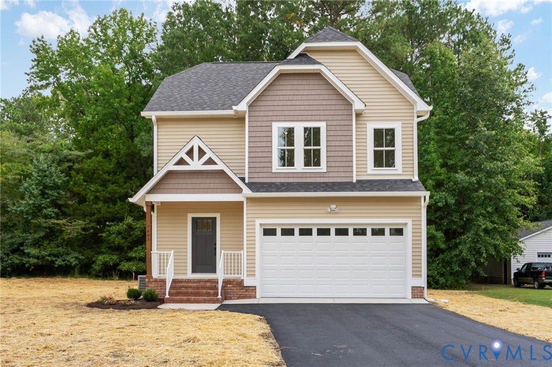 7603 Oster Drive, Chamberlayne Farms Area, Henrico, VA 23227 Craftsman-style exterior with multi-toned siding, attached single-bay garage, front porch with white railing, and a paved driveway