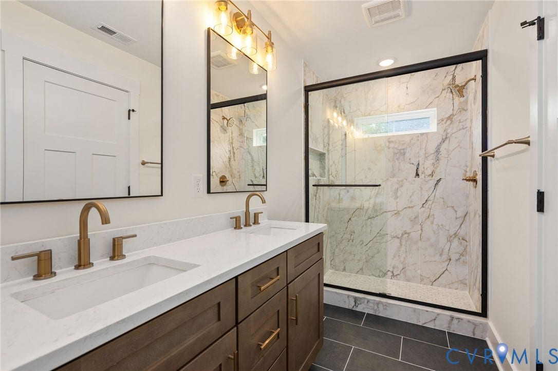 7603 Oster Drive, Chamberlayne Farms Area, Henrico, VA 23227 Dual vanity with white countertops, bronze-finish fixtures, and dark wood-finish cabinetry