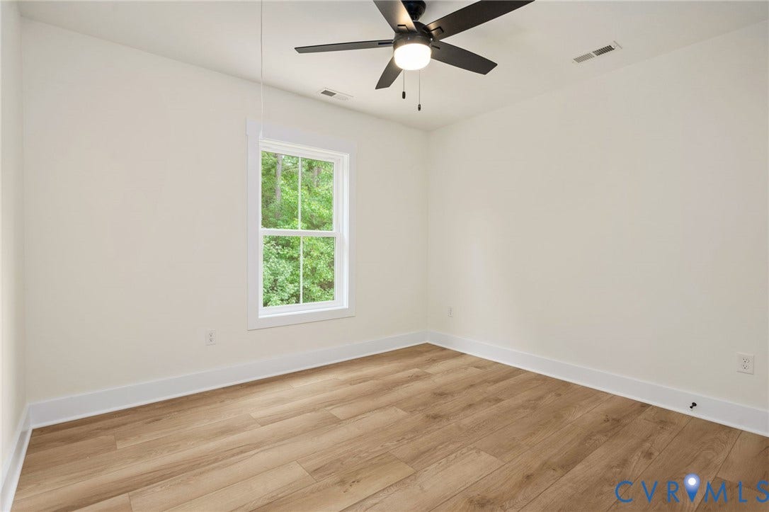 7603 Oster Drive, Chamberlayne Farms Area, Henrico, VA 23227 Wood-finish flooring, white trim, and a ceiling fan with integrated lighting