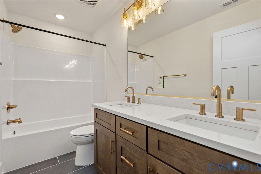7603 Oster Drive, Chamberlayne Farms Area, Henrico, VA 23227 Dual vanity with undermount sinks, bronze finish faucets, and a white countertop