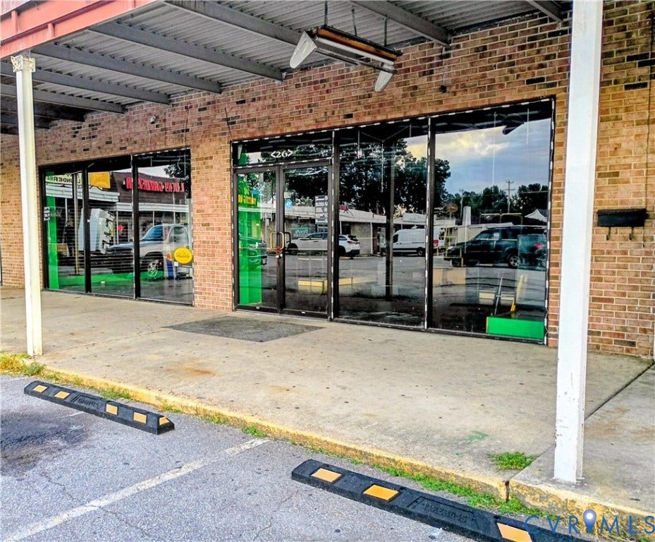 26 Pickwick Avenue, Colonial Heights, VA 23834 Brick exterior with a corrugated metal awning