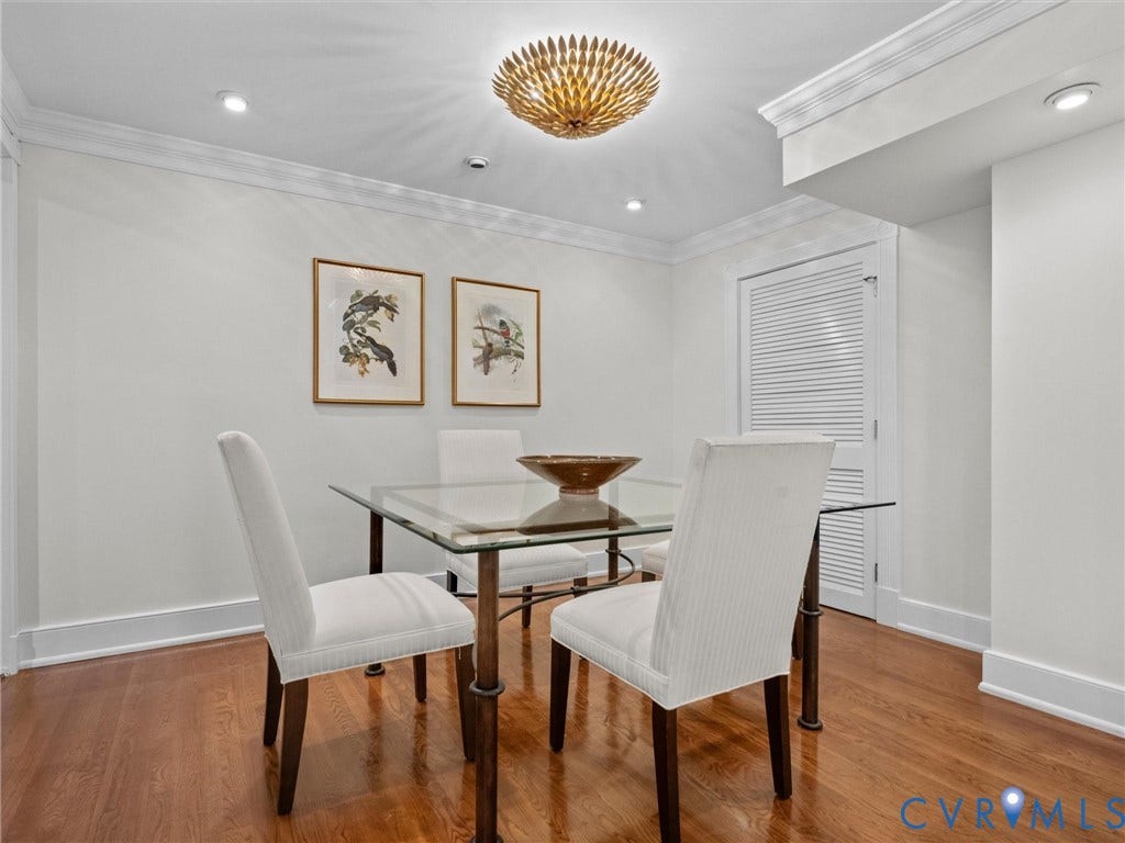 Hardwood flooring, crown molding, recessed lighting, decorative ceiling fixture, louvered door