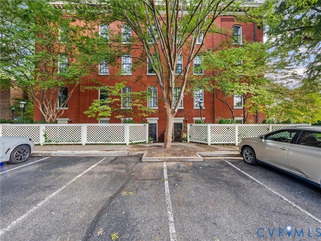 Red brick exterior with multiple windows