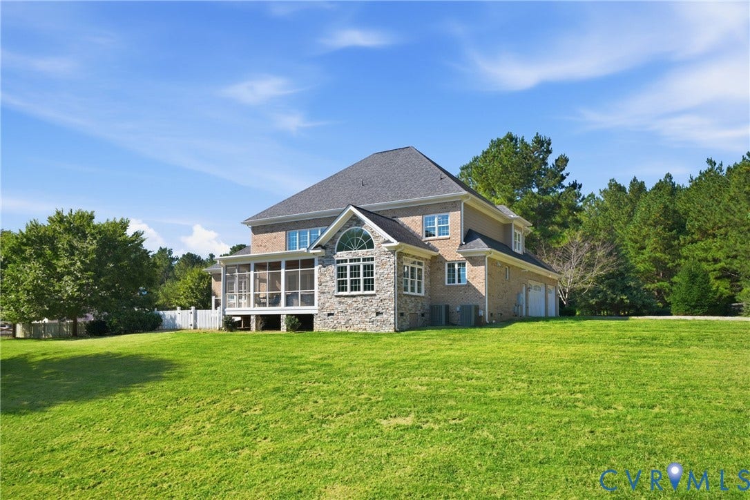 Enjoy a 2.37 acre lot with a fenced garden area and direct water access