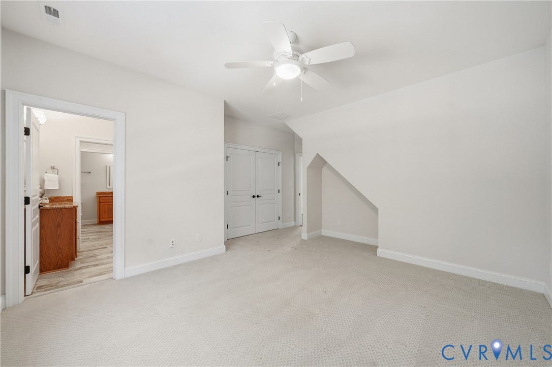 Second floor bedroom with reach-in closet and wall nook, shared access to private powder room and Jack & Jill bathroom