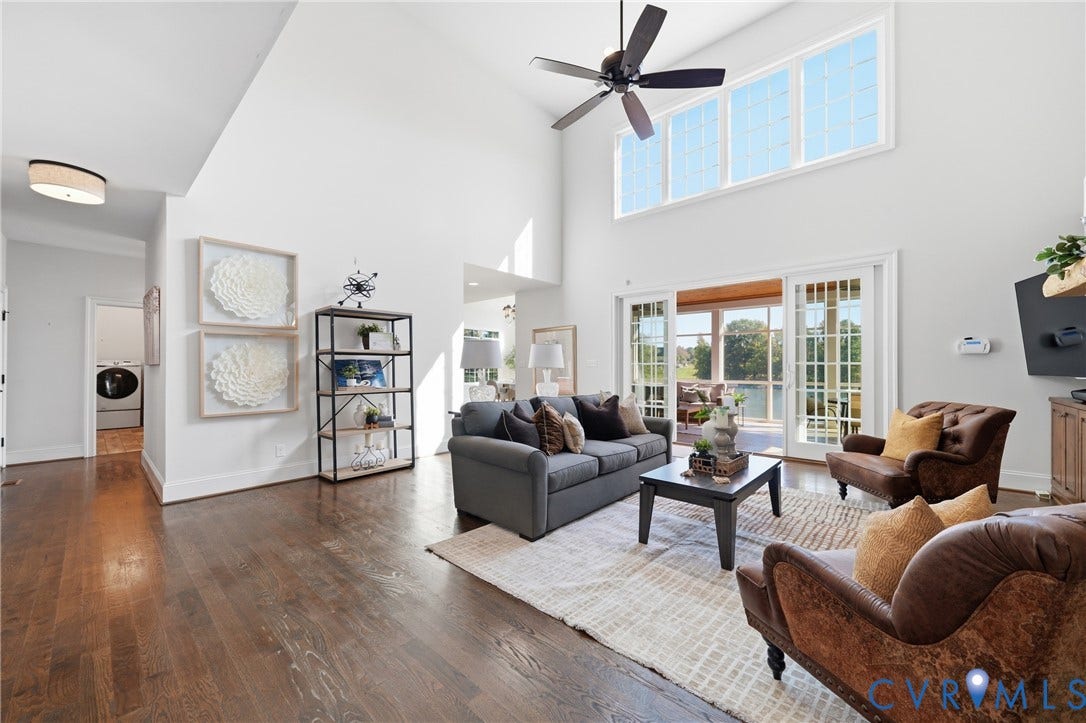 Bright central living space with an open layout and two-story ceilings