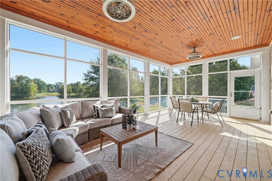 Enjoy views of the pond within the comfort of the large screened-in porch
