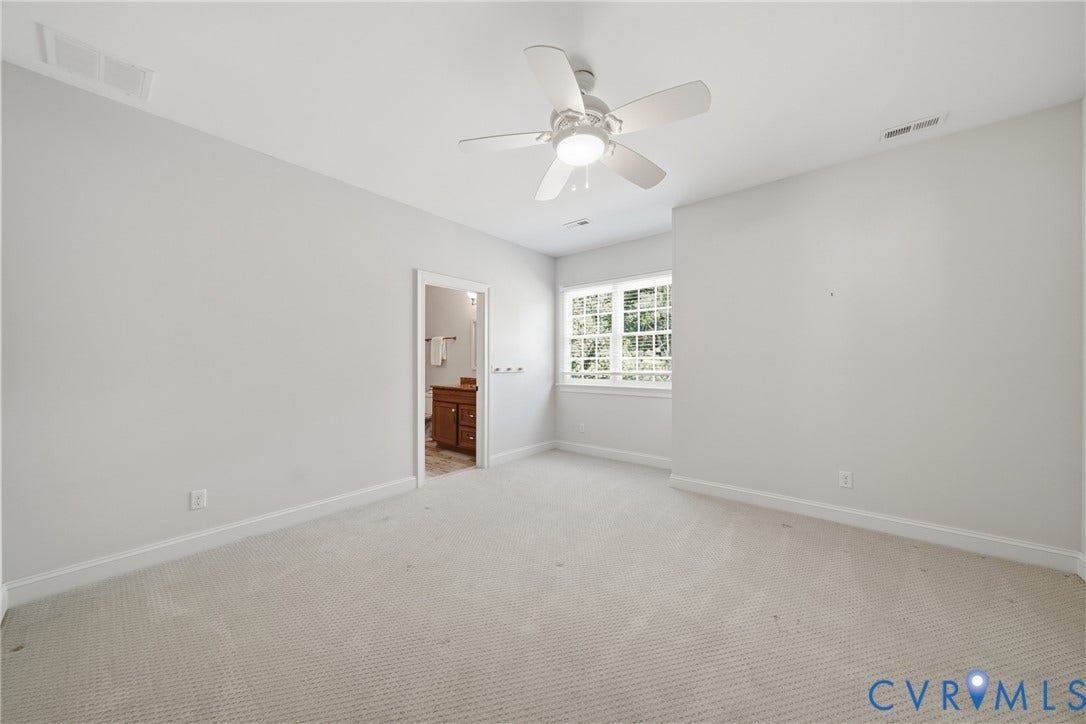 Upper-level bedroom with access to private powder room and Jack and Jill bathroom