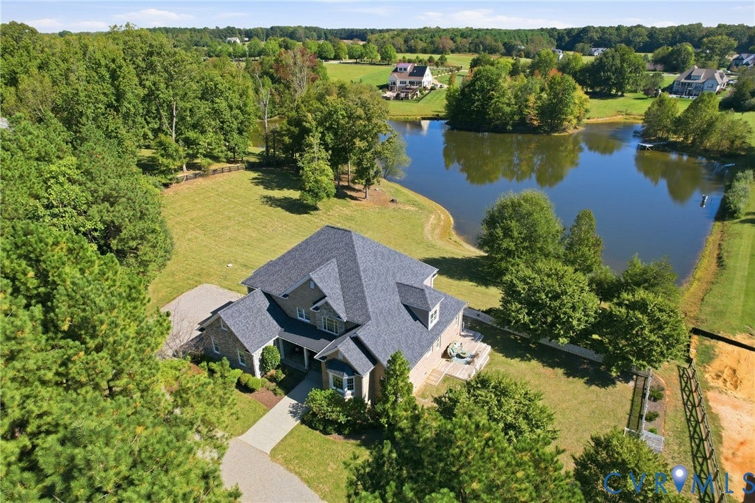 Welcome to 3401 Lake Pines Pl, a waterfront, 5-bedroom, 3.5-bathroom home in the sought after Oak Leaf community of Powhatan