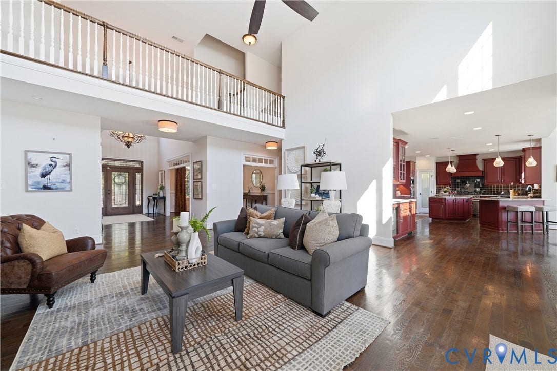 Bright main living space with an open connection to the kitchen and morning room