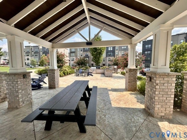 2701 St Elias Drive, #B, Richmond, VA 23294 Covered outdoor pavilion with exposed beam ceiling, brick-clad columns, and stamped concrete flooring