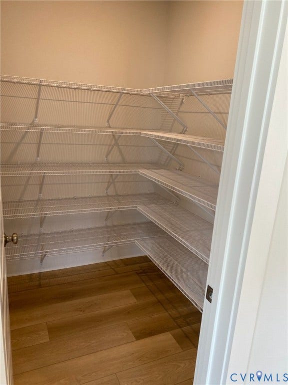 2701 St Elias Drive, #B, Richmond, VA 23294 Walk-in pantry featuring extensive wire shelving and wood-finish flooring
