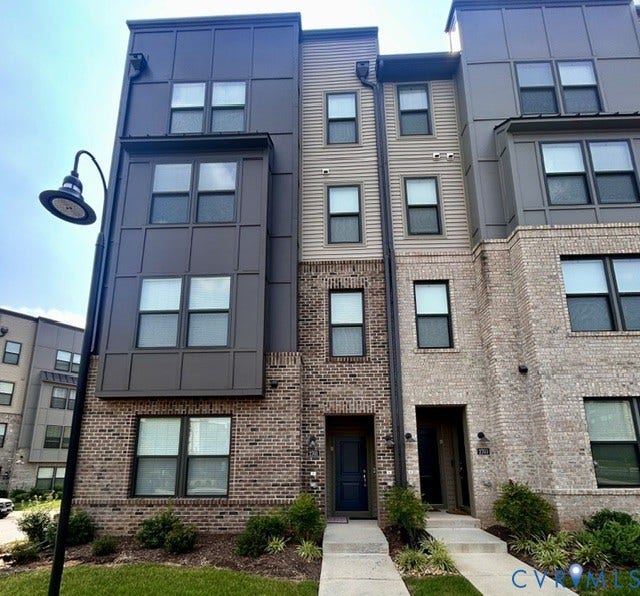 2701 St Elias Drive, #B, Richmond, VA 23294 Multi-story townhouse with brick and siding exterior, multiple windows, front entry doors, and concrete walkways