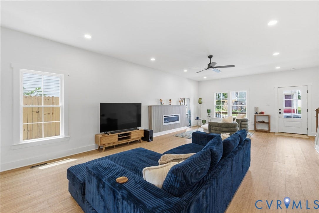 2506 Porter Street, Richmond, VA 23225 Bright living area featuring wood-finish flooring, recessed lighting, a ceiling fan, and a built-in electric fireplace
