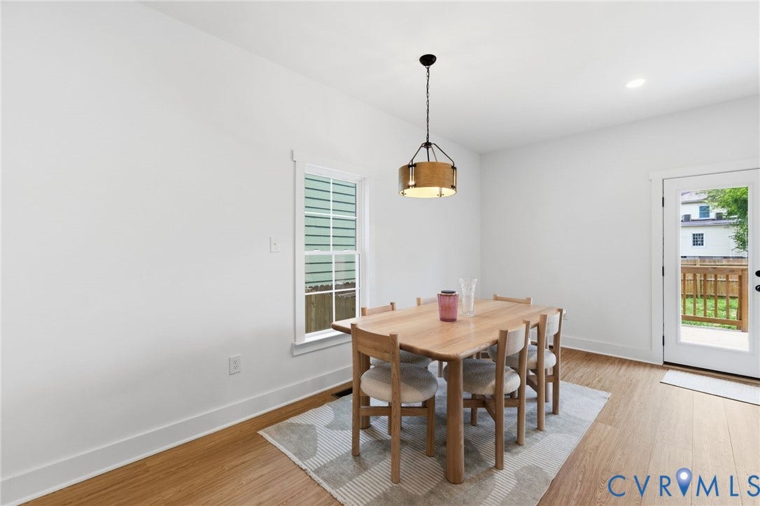 2506 Porter Street, Richmond, VA 23225 White walls, wood-finish flooring, recessed lighting, and a white-framed window