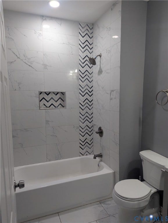 4202 Chamberlayne Avenue, Richmond, VA 23227 Bathtub and shower combination with a tile surround, decorative chevron accent tile, recessed shower niche, and ceiling-mounted lighting